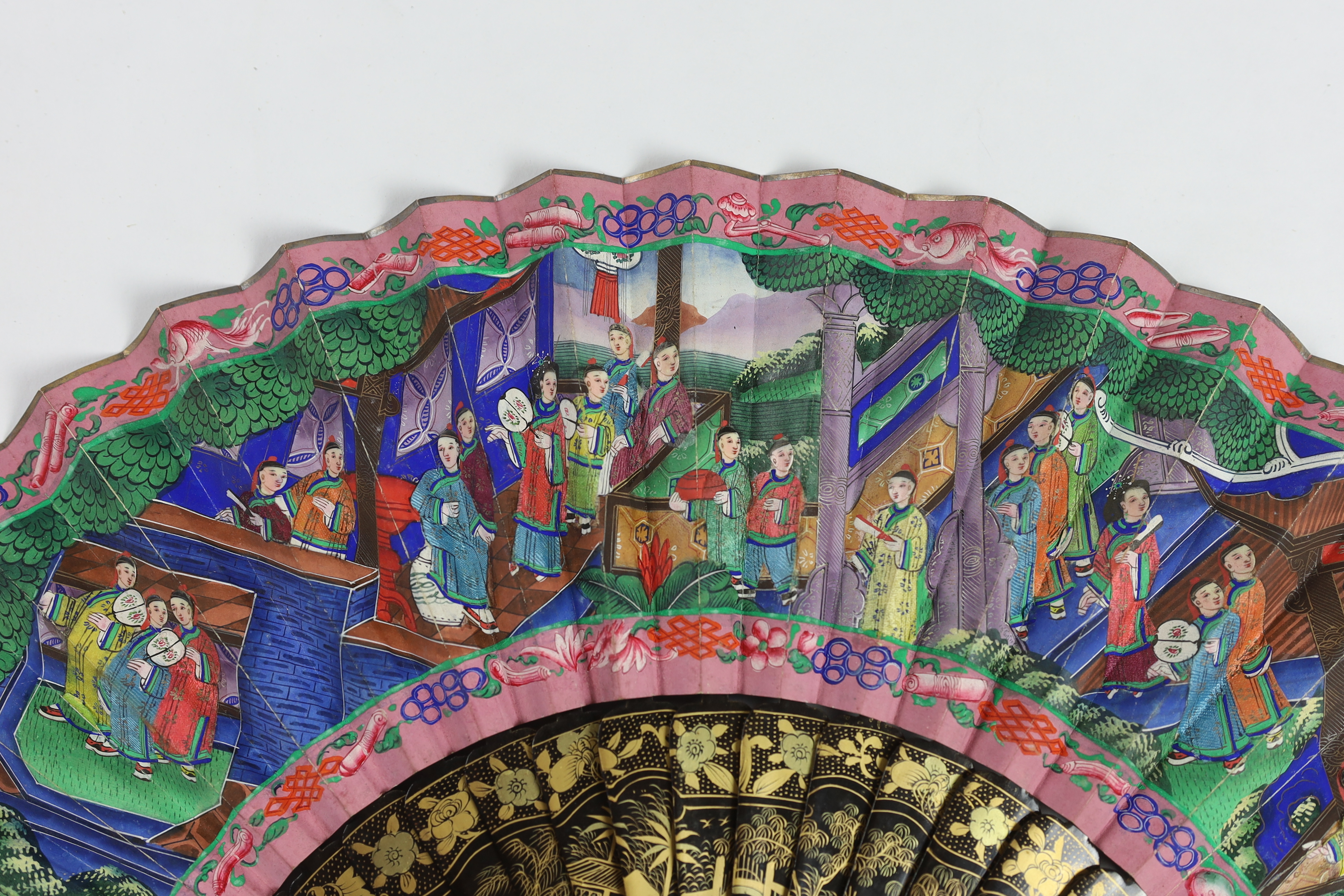 A 19th century Chinese ornately lacquered and hand painted figural leaf fan, the figures on the leaf having painted ivory faces, the back of the fan painted with exotic birds and flowers, CITES Submission reference TJUZX